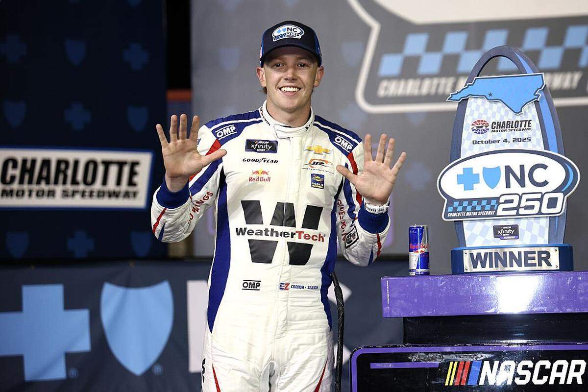 Connor Zilisch, driver of the #88 WeatherTech Chevrolet, celebrates in victory lane after winning the NASCAR Xfinity Series Blue Cross NC 250 at Charlotte Motor Speedway on October 04, 2025 in Concord, North Carolina. 