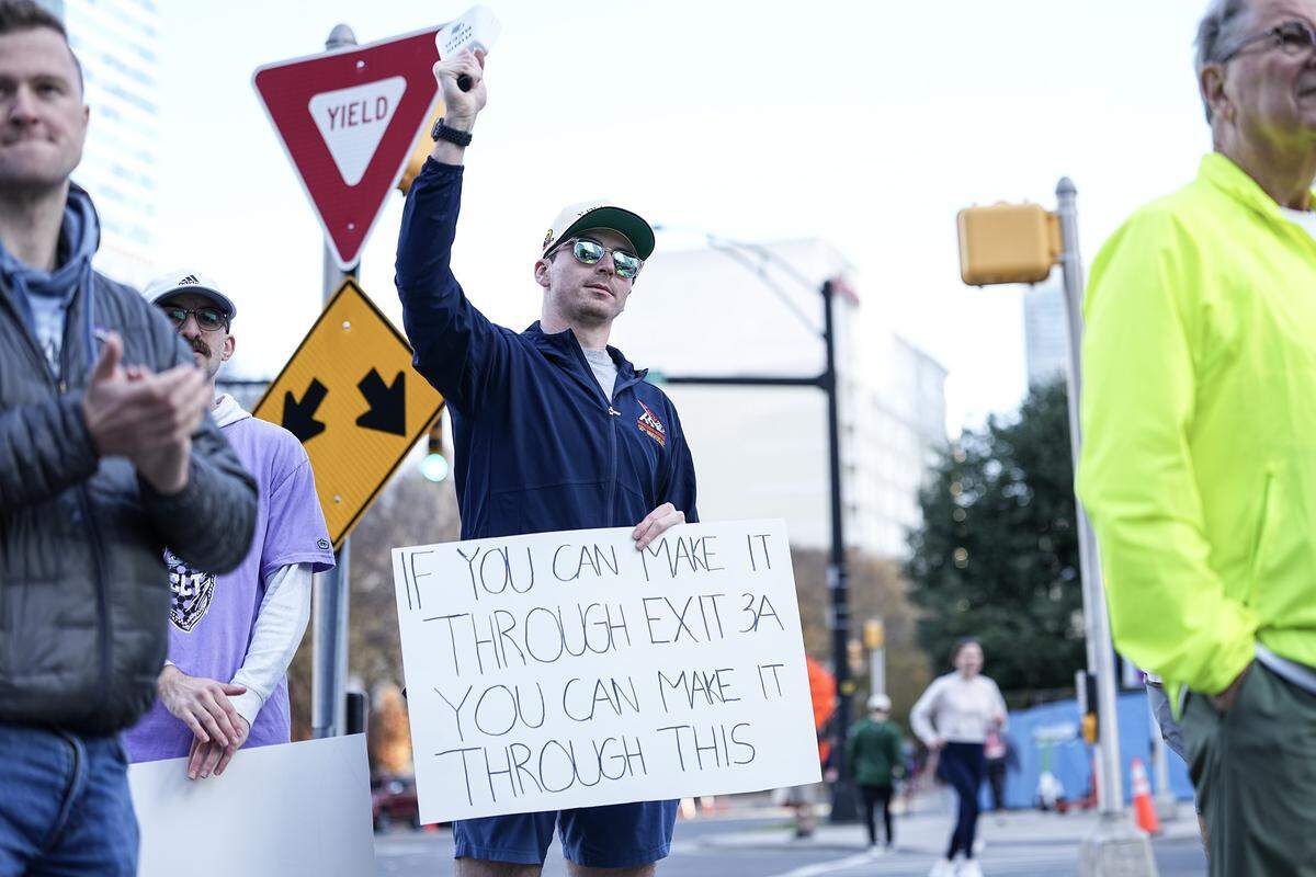 Supporters cheer on participants in the Novant Health Charlotte Marathon Saturday, Nov. 15, 2025, in Charlotte, N.C.