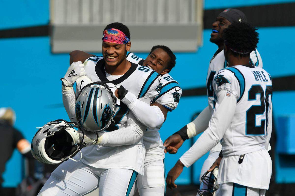 Carolina Panthers defensive end Yetur Gross-Matos (97) celebrates with teammate cornerback Troy Pride Jr. (25) after their game against the Arizona Cardinals at Bank of America Stadium in Charlotte, NC on Sunday, October 4, 2020. The Panthers won, 31-21