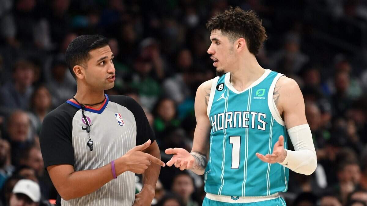 Umpire Suyash Mehta, left, speaks with Charlotte Hornets guard LaMelo Ball, right, during second half action against the Boston Celtics at Spectrum Center in Charlotte, NC on Monday, January 16, 2023. The Celtics defeated the Hornets 130-118.