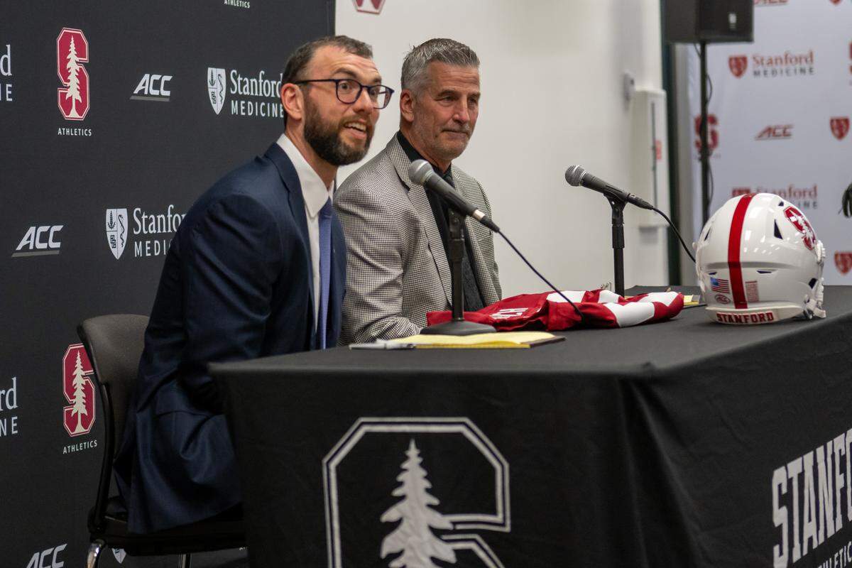 Stanford football general manager Andrew Luck, left, with new coach Frank Reich at Tuesday’s introductory press conference in Stanford, Calif. Courtesy of Stanford Athletics