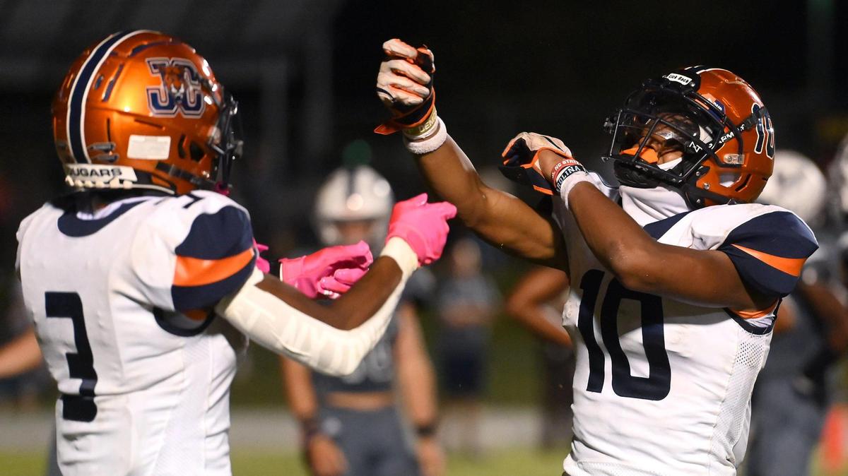 Chambers High wide receiver Zion Booker, left, celebrates with running back Braylon Vinson, right, following Vinson’s touchdown run against the Hickory Ridge defense during second quarter action on Friday, September 9, 2022.