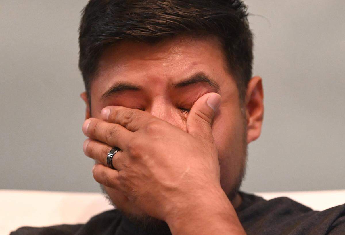 Santiago Lagunas cries as he talks about his son, Liam Lagunas, 6, who was killed in a crash caused by street racing in 2021.