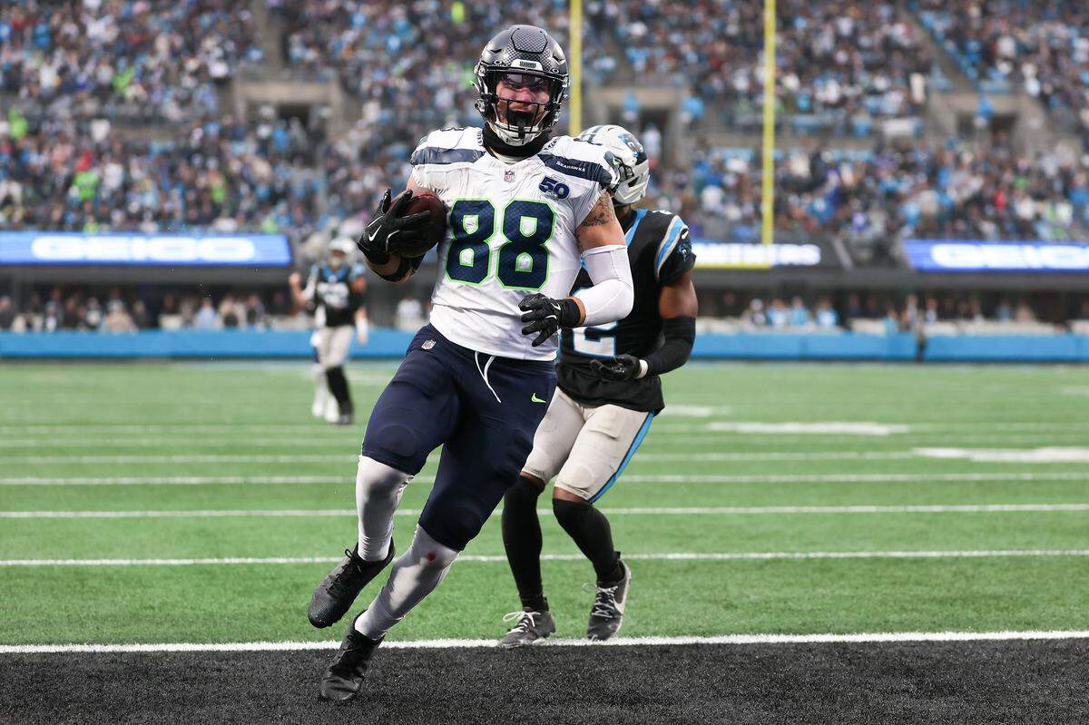 AJ Barner of the Seattle Seahawks scores a third-quarter touchdown against the Carolina Panthers on Sunday at Bank of America Stadium.