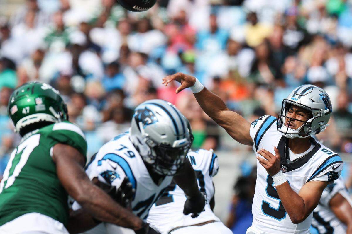Panthers quarterback Bryce Young, far right, throws a pass during the preseason game against the Jets at Bank of America Stadium on Saturday, August 12, 2023 in Charlotte, NC.
