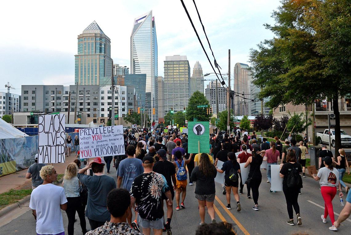 Demonstrators march into uptown Charlotte, NC on S. Tryon St. on Friday, June 5, 2020. Demonstrators have been marching throughout Charlotte for eight days in response to the killing of George Floyd, a black man who was killed on Monday, May 25, 2020 by a Minneapolis, MN police officer.