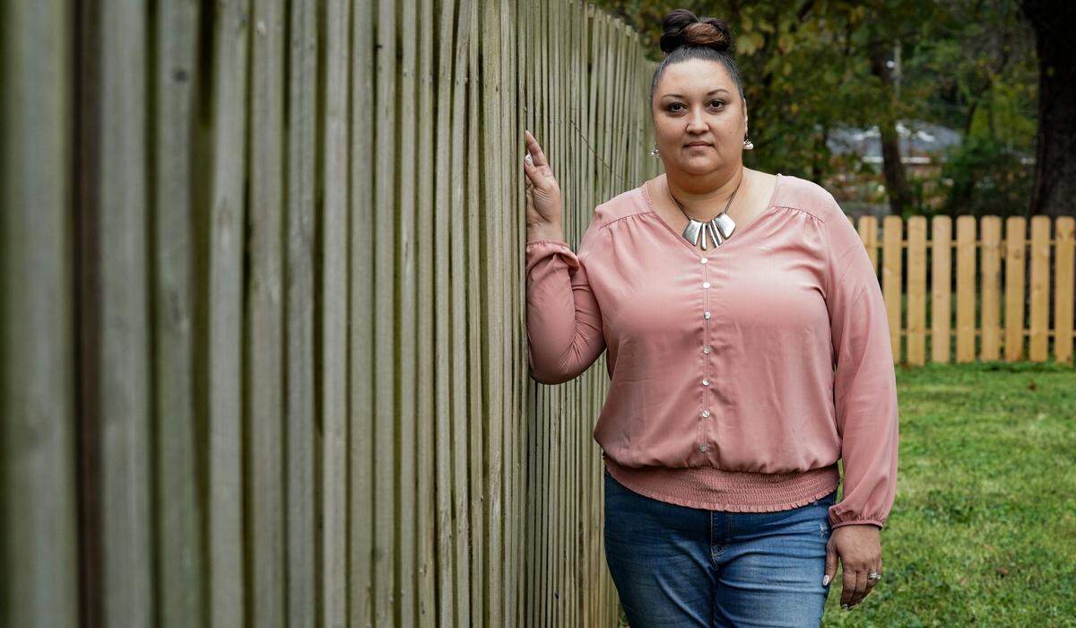 Longtime Howie Acres resident ​Stephane Berwald Joyner stands in her yard outside her home in November. Berwald Joyner wants the neighborhood’s history to be preserved.