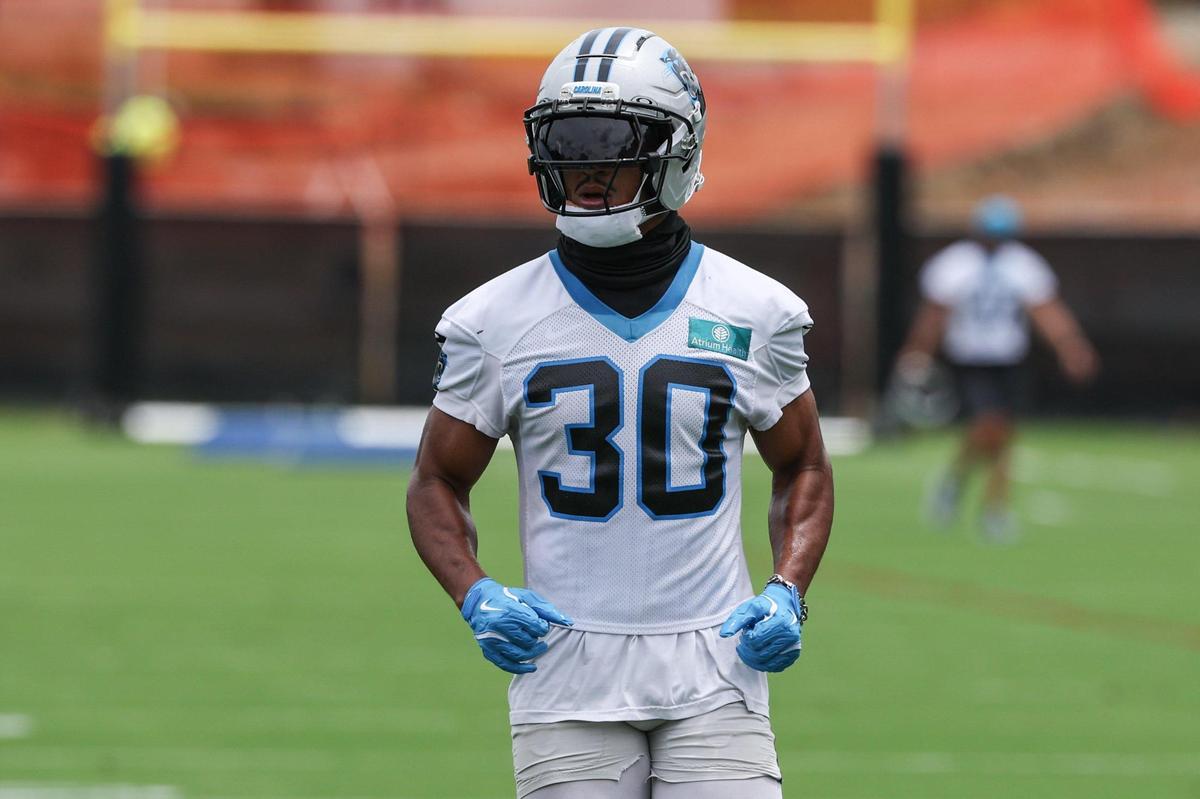 Panthers running back Chuba Hubbard runs through a drill during the first day of minicamp at the practice fields on June 10.