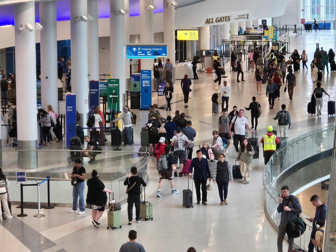 Passengers travel through Charlotte Douglas International Airport to check in with airlines and for security agents.