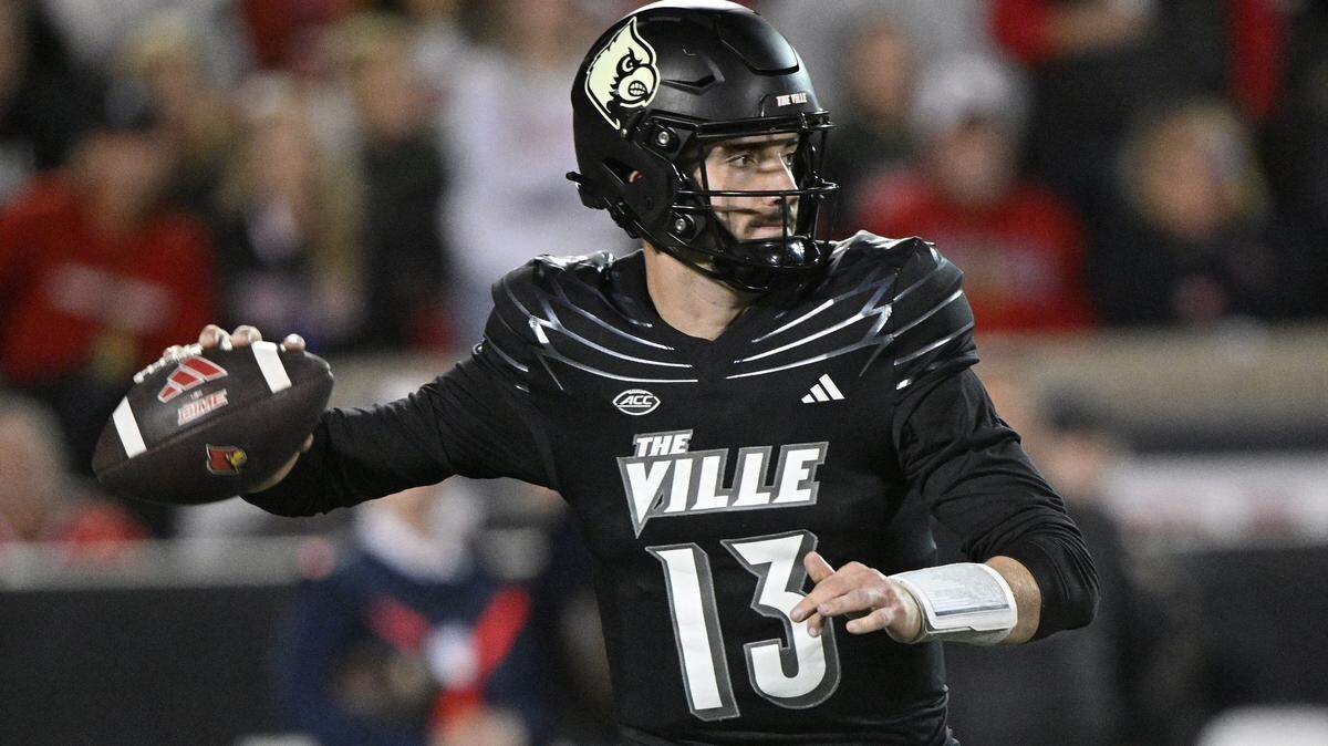 Nov 9, 2023; Louisville, Kentucky, USA; Louisville Cardinals quarterback Jack Plummer (13) looks to pass against the Virginia Cavaliers during the second half at L&N Federal Credit Union Stadium. Louisville defeated Virginia 31-24. Mandatory Credit: Jamie Rhodes-USA TODAY Sports