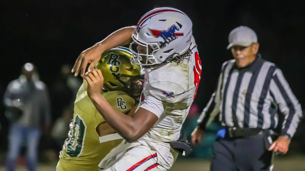Providence Day quarterback Zaid Lott is sacked as he tries to throw the ball up the field during the NCISAA state championship game at Rabun Gap school in Rabun Gap GA on November 15th
