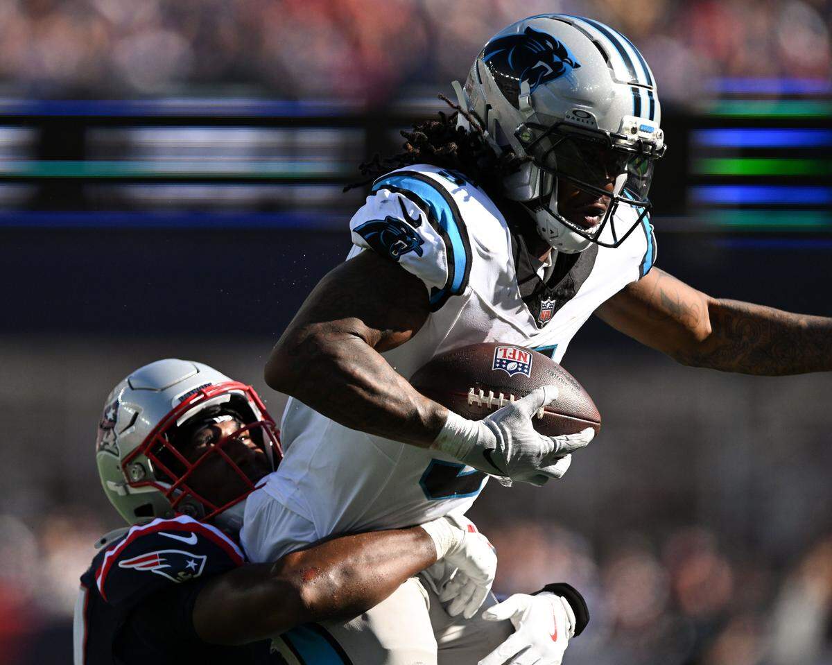 Carolina Panthers running back Rico Dowdle (5) runs against the New England Patriots on Sept. 28, 2025.
