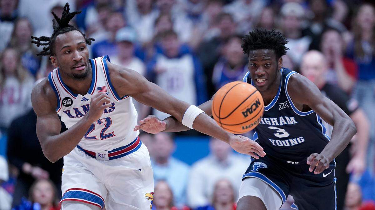 Darryn Peterson, left, of Kansas and AJ Dybantsa of BYU chase down a loose ball in the first half at Allen Fieldhouse on January 31, 2026 in Lawrence, Kansas. Peterson and Dybantsa are widely expected to be taken with the top two picks in the 2026 NBA Draft.