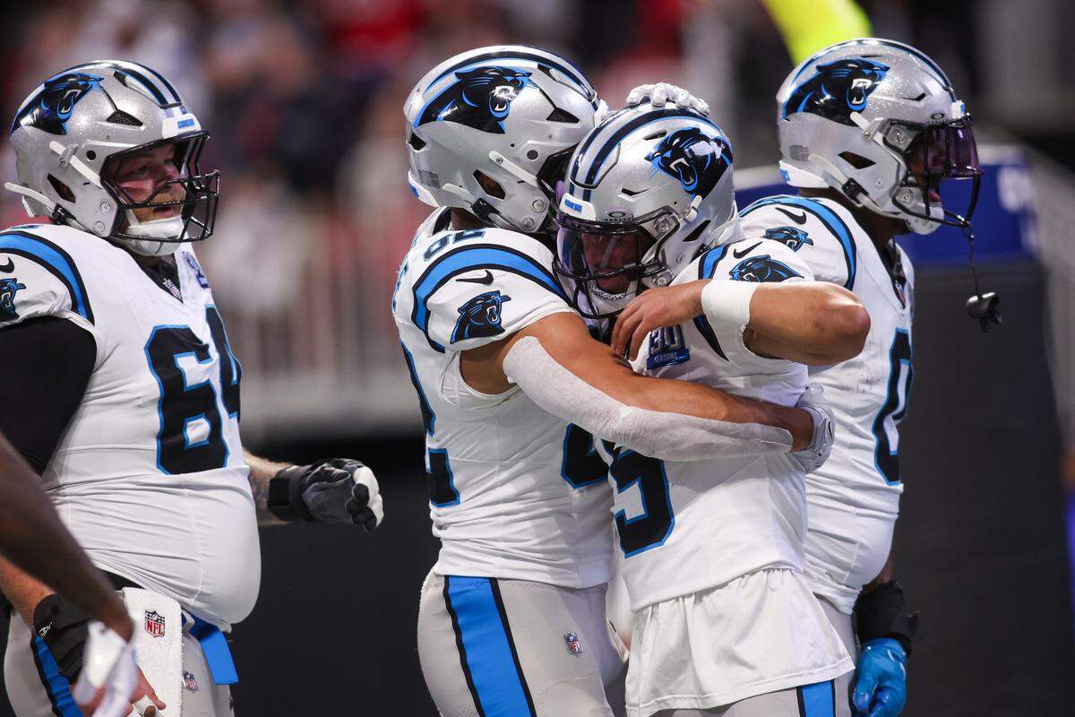 Carolina Panthers quarterback Bryce Young (9) celebrates with tight end Tommy Tremble (82) after a touchdown run against the Atlanta Falcons in Sunday’s second quarter at Mercedes-Benz Stadium.