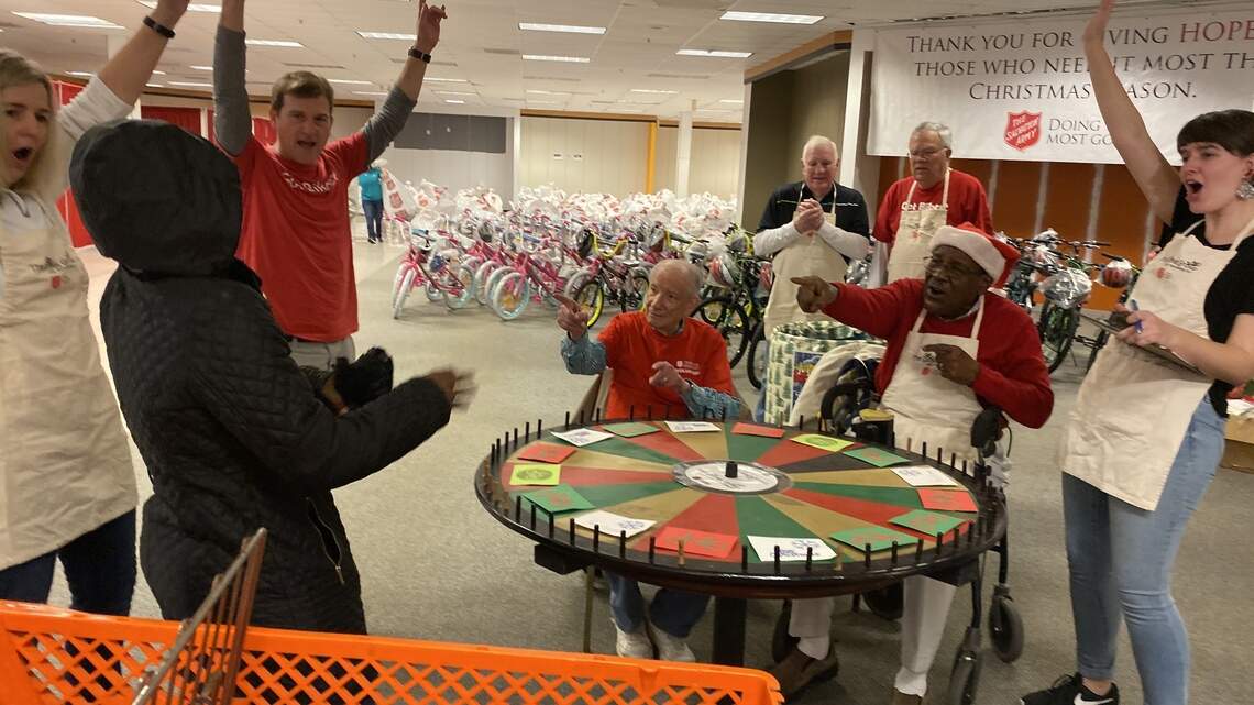 Lots of smiles as families pick up wish list donations at the Salvation Army