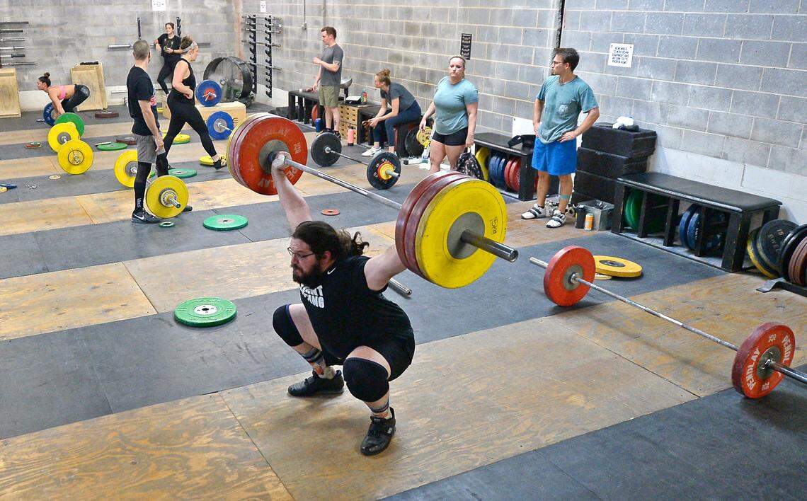 Olympic weightlifter Caine Wilkes originally took up the sport in middle school with the idea that it would help him in football.