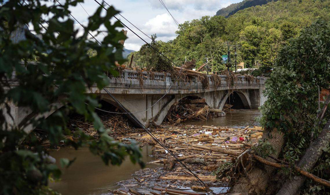 Debris from Hurricane Helene are seen on and under the old bridge that connects Lake Lure and Chimney Rock in Lake Lure, N.C. on Sunday, September 29, 2024. 
