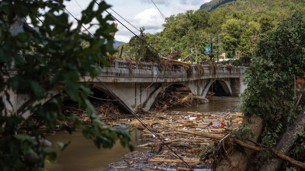 Debris from Hurricane Helene are seen on and under the old bridge that connects Lake Lure and Chimney Rock in Lake Lure, N.C. on Sunday, September 29, 2024.