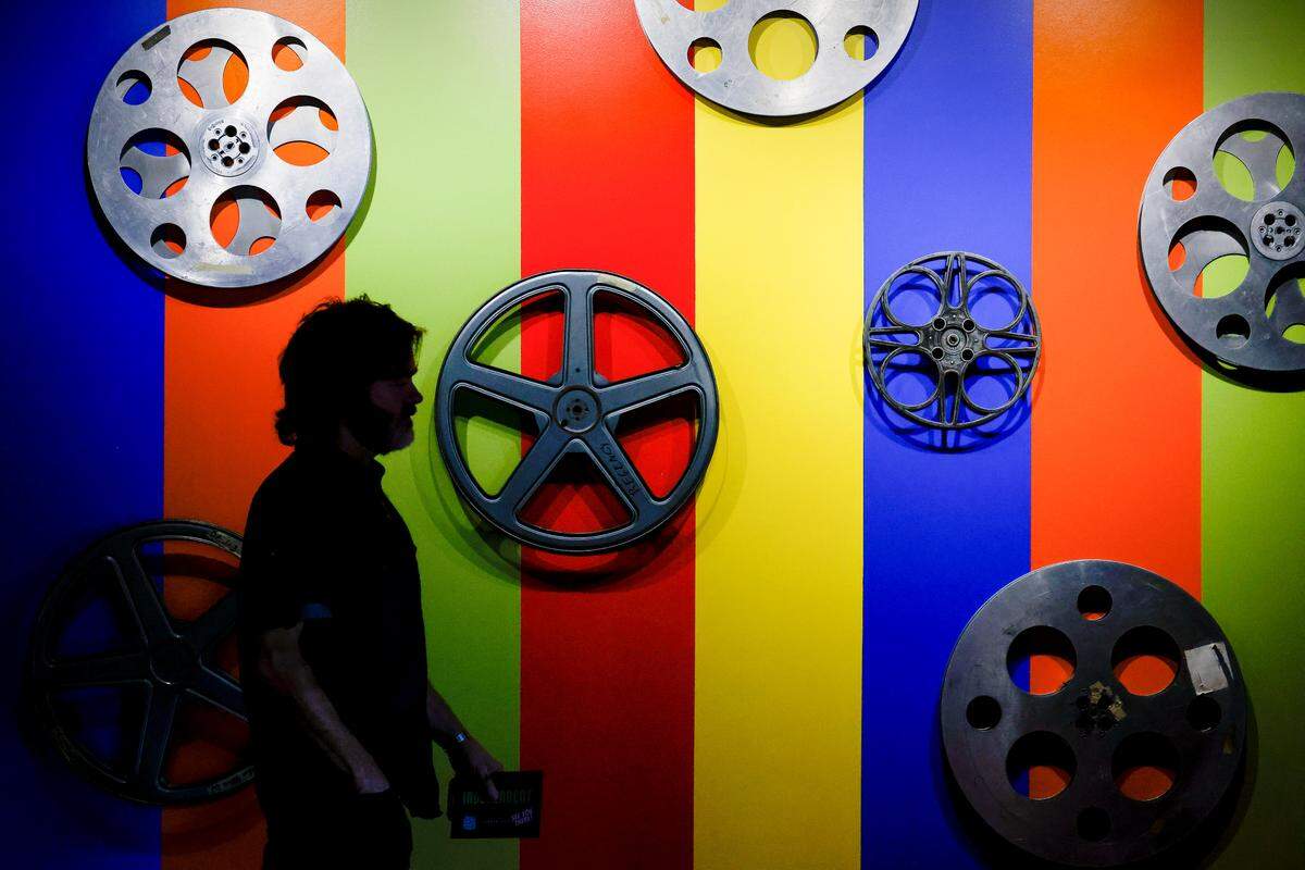 Scott Weaver helped decorate the lobby at the Independent Picture House in Charlotte, the city’s new and only art house cinema.