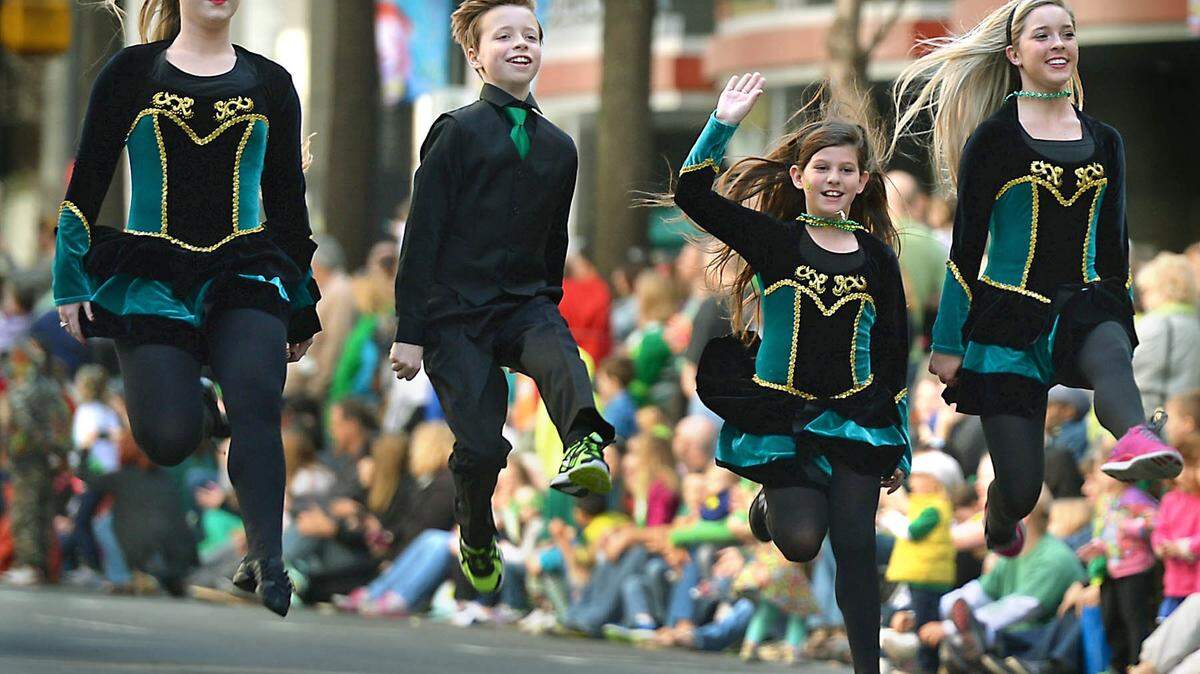 The Rince na h’Eireann Irish Dancers kick up their heels at the Saint Patrick’s Day Parade in uptown Charlotte Saturday, March 15, 2014.