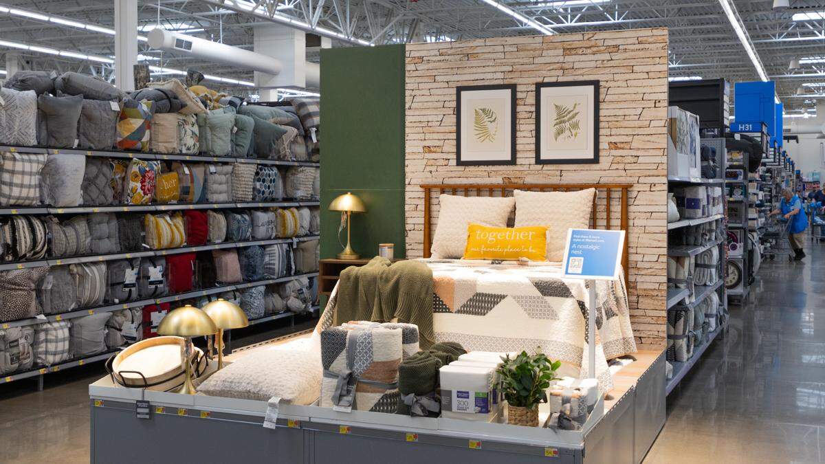 Walmart store remodels include department displays so customers can touch and feel products, as well as use a QR code for more information.