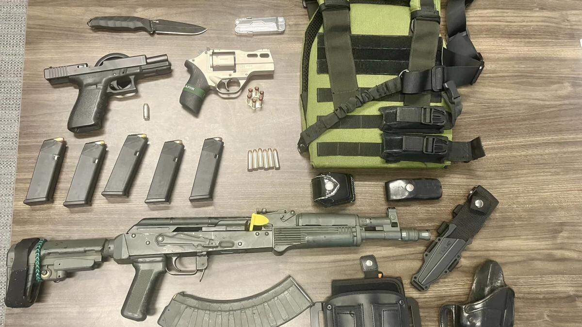 A Monroe man wearing a bulletproof vest and carrying multiple firearms inside of Walmart was arrested without incident Monday.