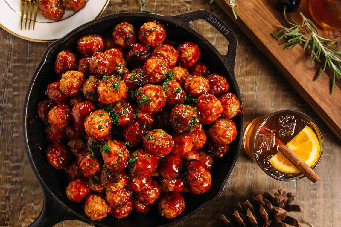 Craig Barbour, executive chef and owner of Roots Catering + Cafe, makes Carolina Bison cocktail meatballs with bourbon cherry glaze at Thanksgiving.