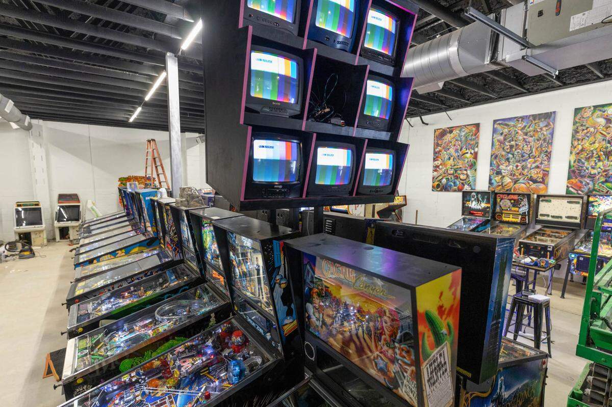 Super Abari Game Bar’s game room. The art on the right wall is by Charlotte artist John Hairston Jr.