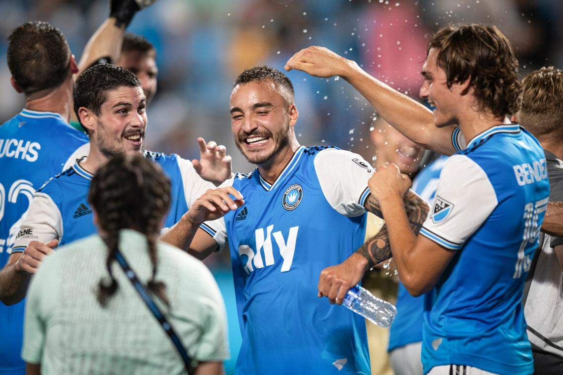 Charlotte FCís Sergio Ruiz (6), Andre Shinyashiki (16), and Benjamin Bender (15) celebrate after a 4-1 victory against Nashville SC at Bank of America Stadium in Charlotte, N.C. on Saturday, July 9, 2022.