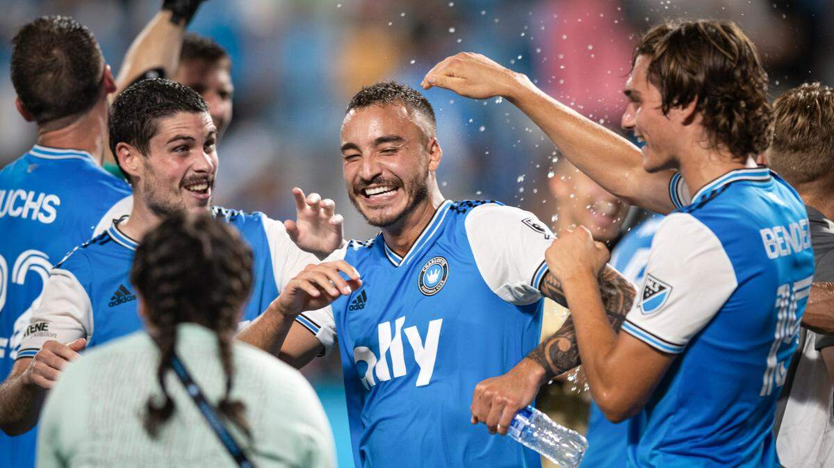 Charlotte FCís Sergio Ruiz (6), Andre Shinyashiki (16), and Benjamin Bender (15) celebrate after a 4-1 victory against Nashville SC at Bank of America Stadium in Charlotte, N.C. on Saturday, July 9, 2022.