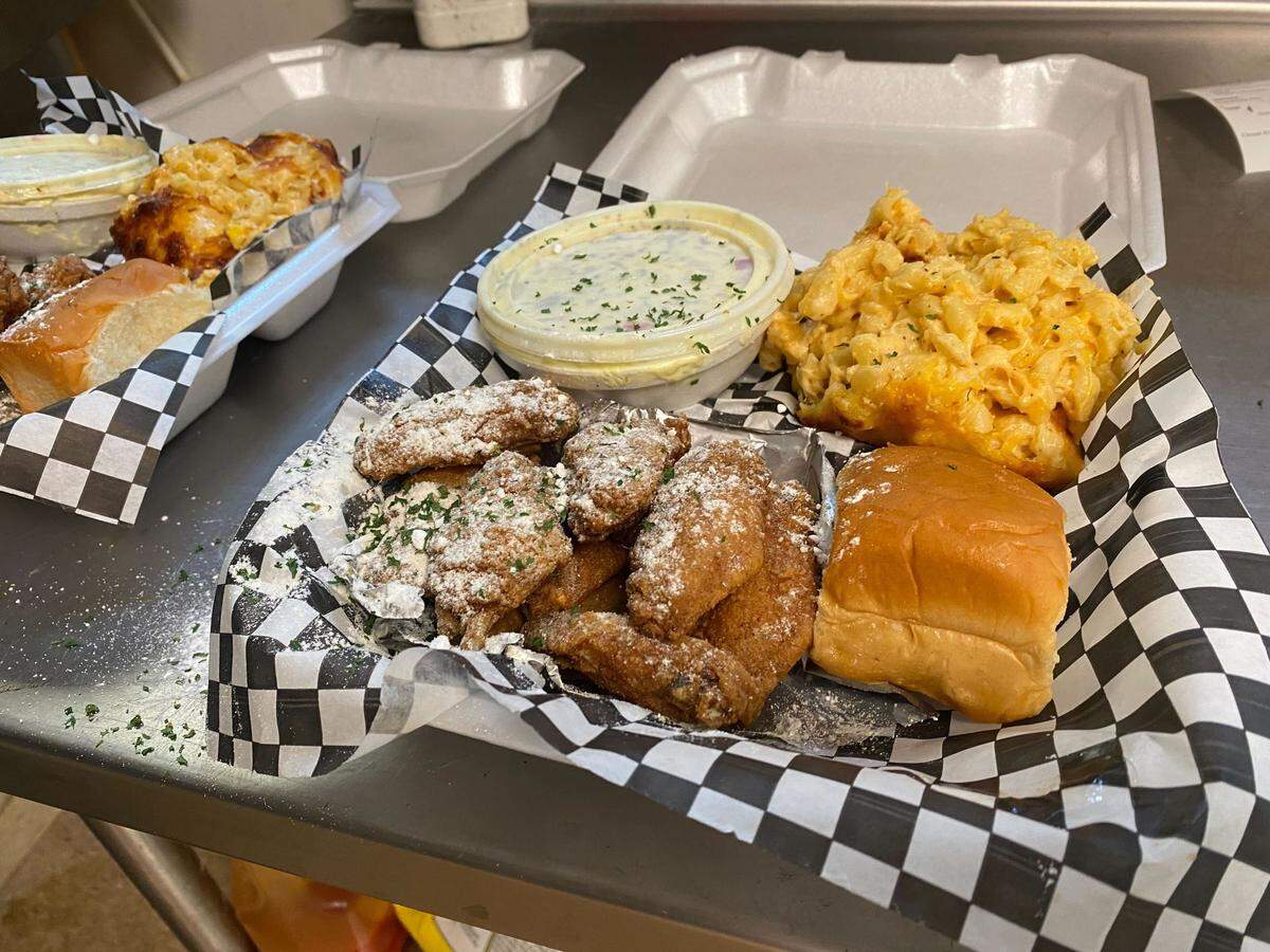 Everybody Eatz, located at 3720 N. Tryon St., in Charlotte with their crack powder wings with a side of mac n cheese and potato salad.
