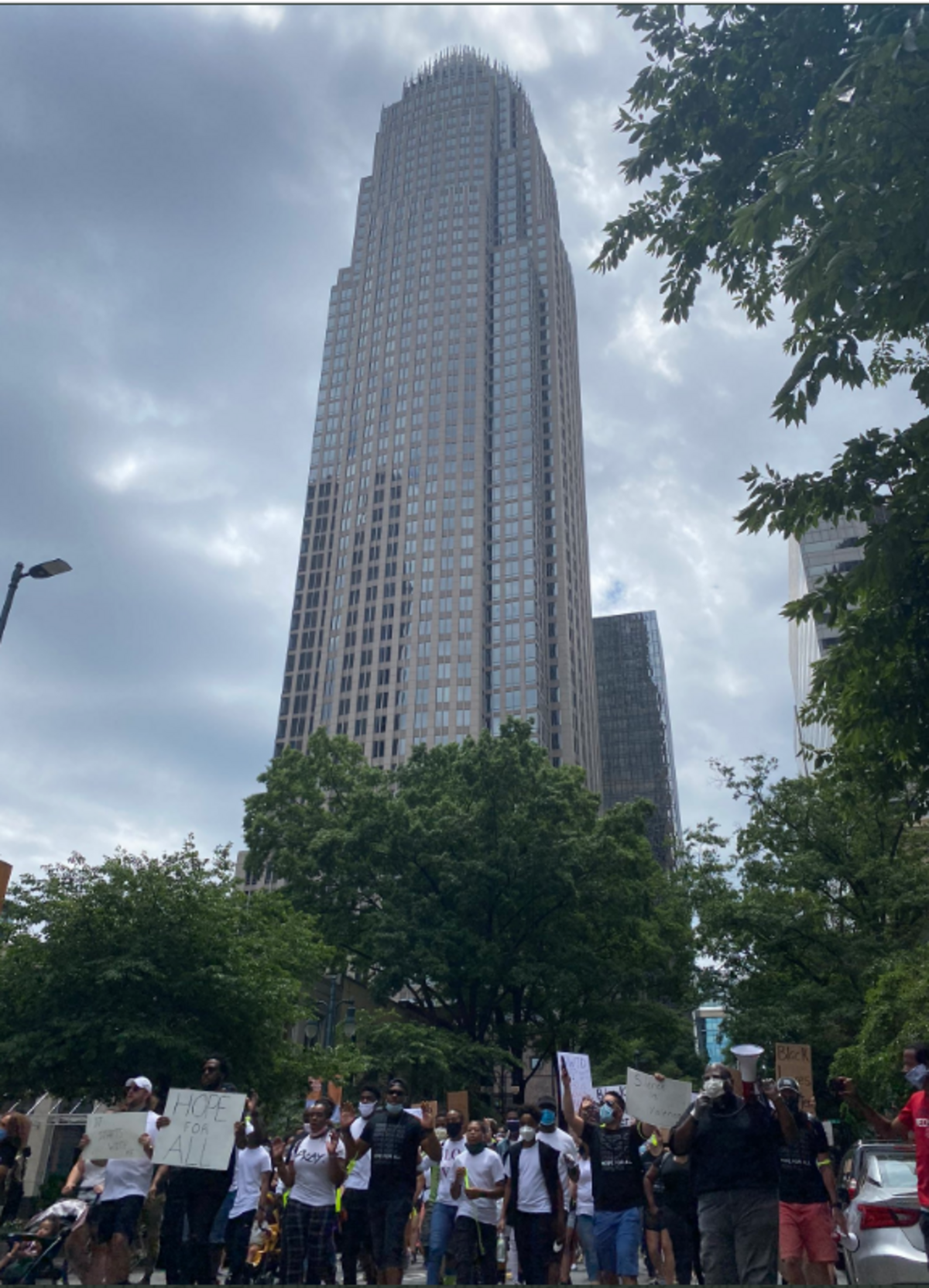  the marchers who gathered in First Ward stretched four blocks down Tryon Street, chanting “Black lives matter” in front of the Bank of America tower at The Square.
