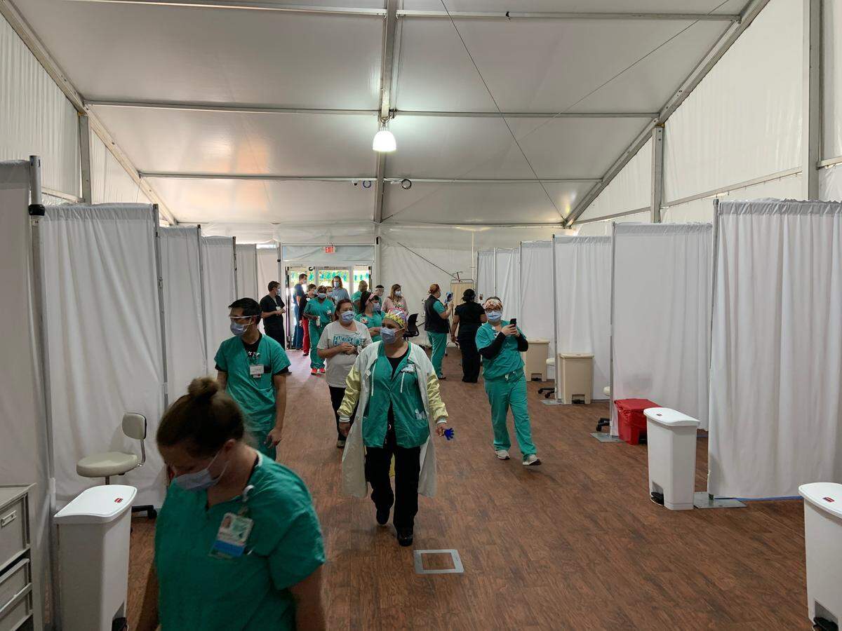 Triage tent set up for screening people with mild COVID-19 symptoms outside Atrium Health’s Main campus, formerly Carolinas Medical Center - Main, in Charlotte. The hospital’s emergency medicine team, along with Team Rubicon, assembled triage tents outside the emergency department on April 15, 2020.