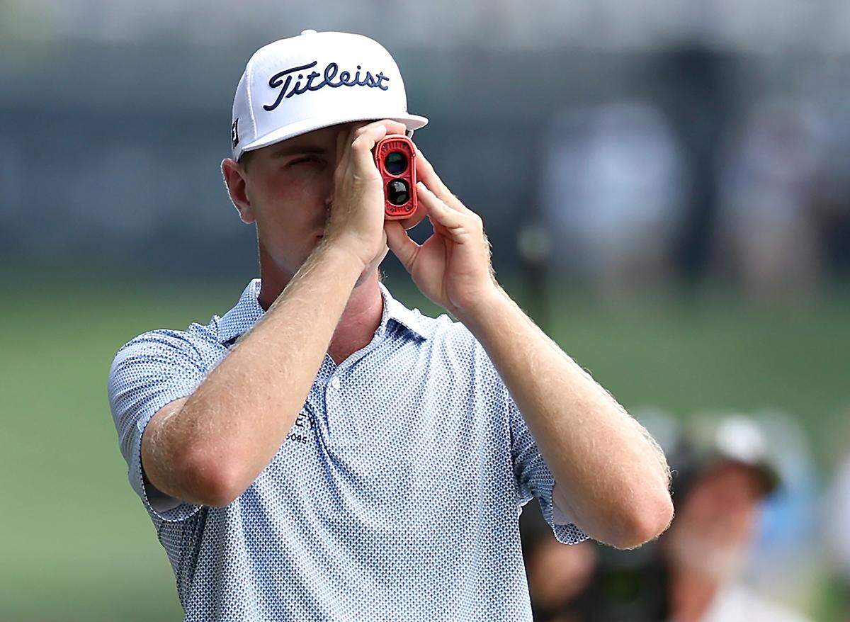 Ryan Gerard uses a rangefinder along the 18th fairway during opening round action of the 107th PGA Championship at Quail Hollow Club in Charlotte, NC on Thursday, May 15, 2025.