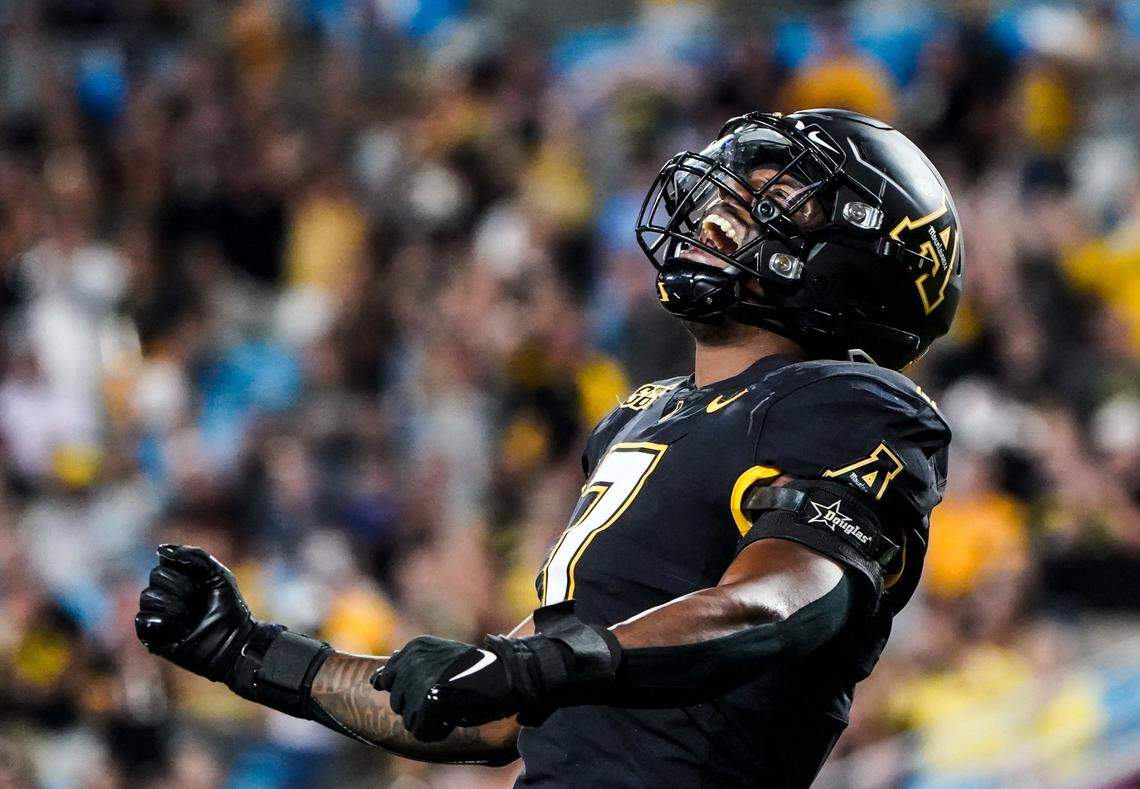 App State inside linebacker Trey Cobb celebrates during the Mountaineers’ 33-19 win over East Carolina at Bank of America Stadium in Charlotte.