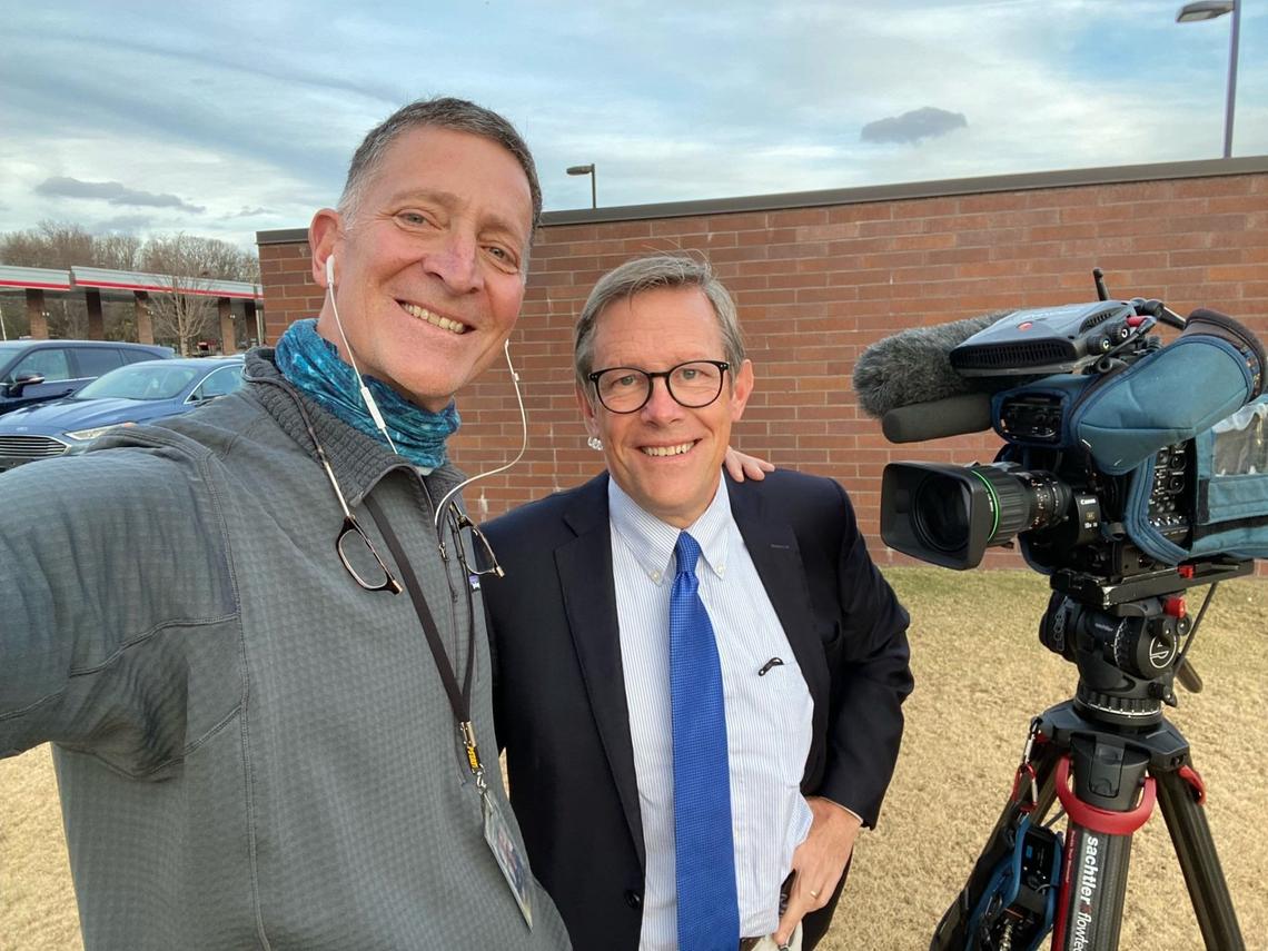 WSOC chief photographer Bill Bruce with Mark Becker, in a photo taken after Becker’s last live shot for Channel 9.