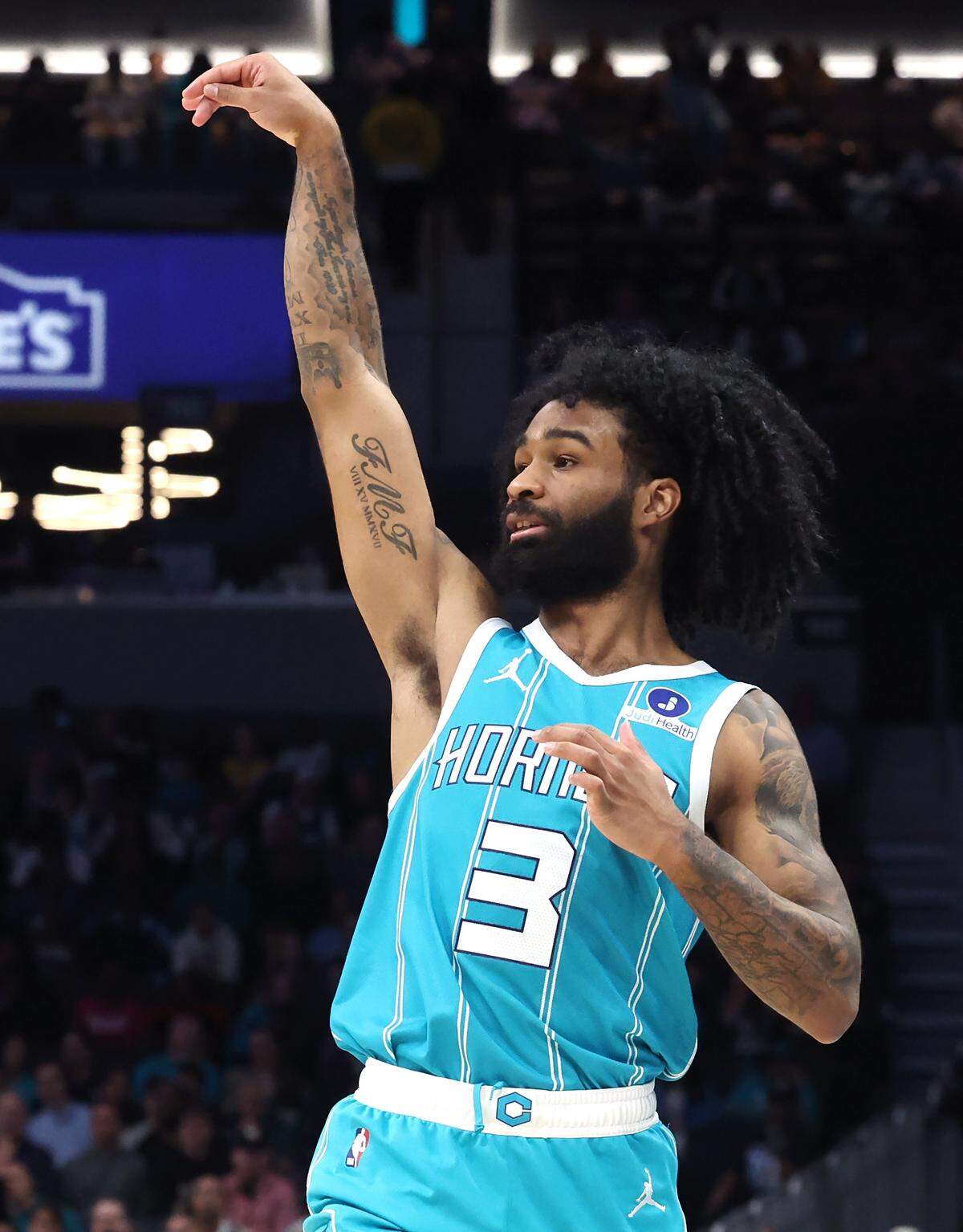 Charlotte Hornets guard Coby White takes a three-point shot against the Orlando Magic at Spectrum Center in Charlotte, North Carolina, on Thursday, March 19, 2026.