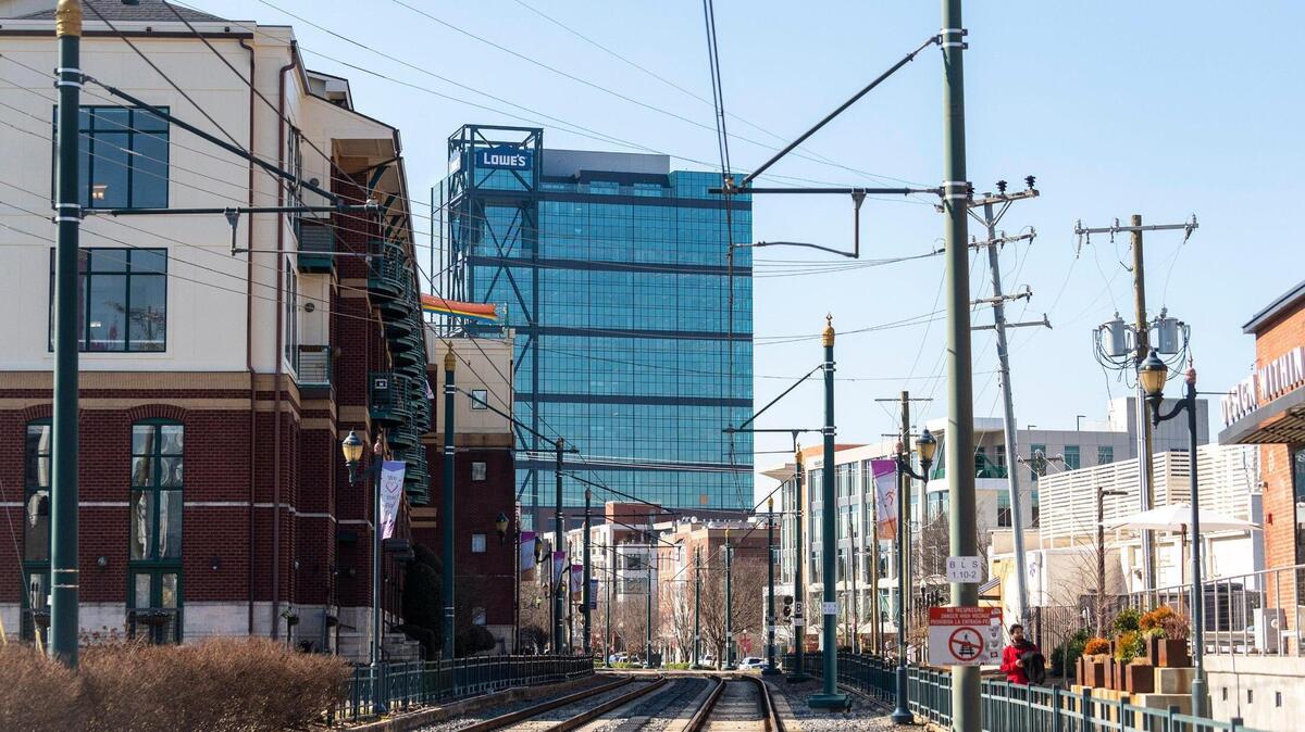 The new Lowe’s Design Center tower in South End is seen from the light rail. The 23-story tower will be one of many high-rise buildings in the neighborhood as developers are planning several new office and residential towers over the next few years.