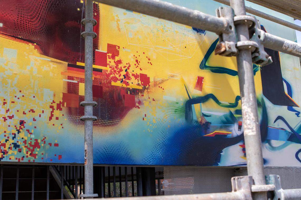 A close up look at Ivan Depeña’s latest work along Charlotte’s Rail Trail showcases a variety of geometric shapes and patterns.