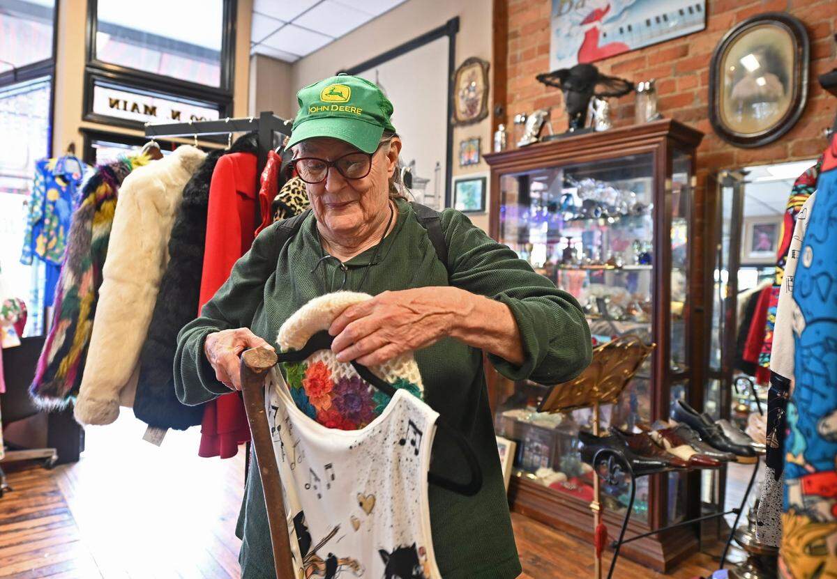 Eleanor Abbot shops for a new hat at Backstage Unique Vintage Apparel in Monroe on Wednesday. Abbot said that she is happy with the results of the presidential election.