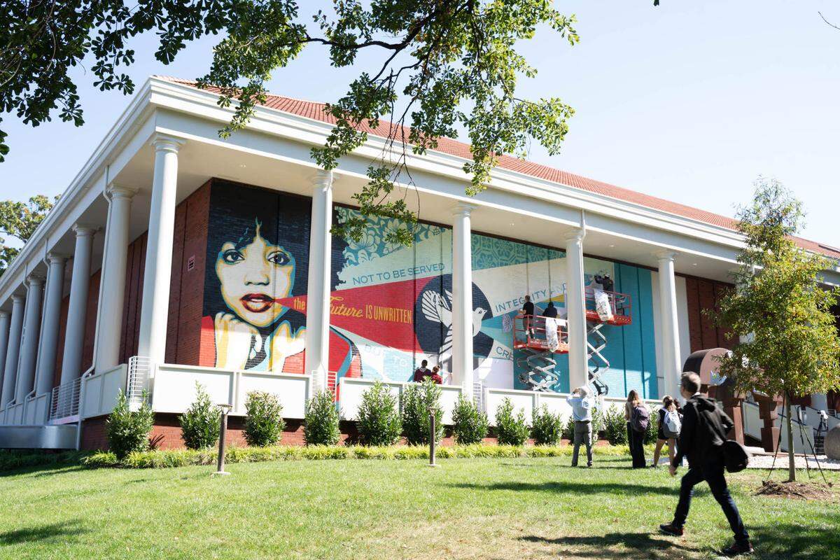 Shepard Fairey paints a mural at Queens University of Charlotte on Thursday, Oct. 21.