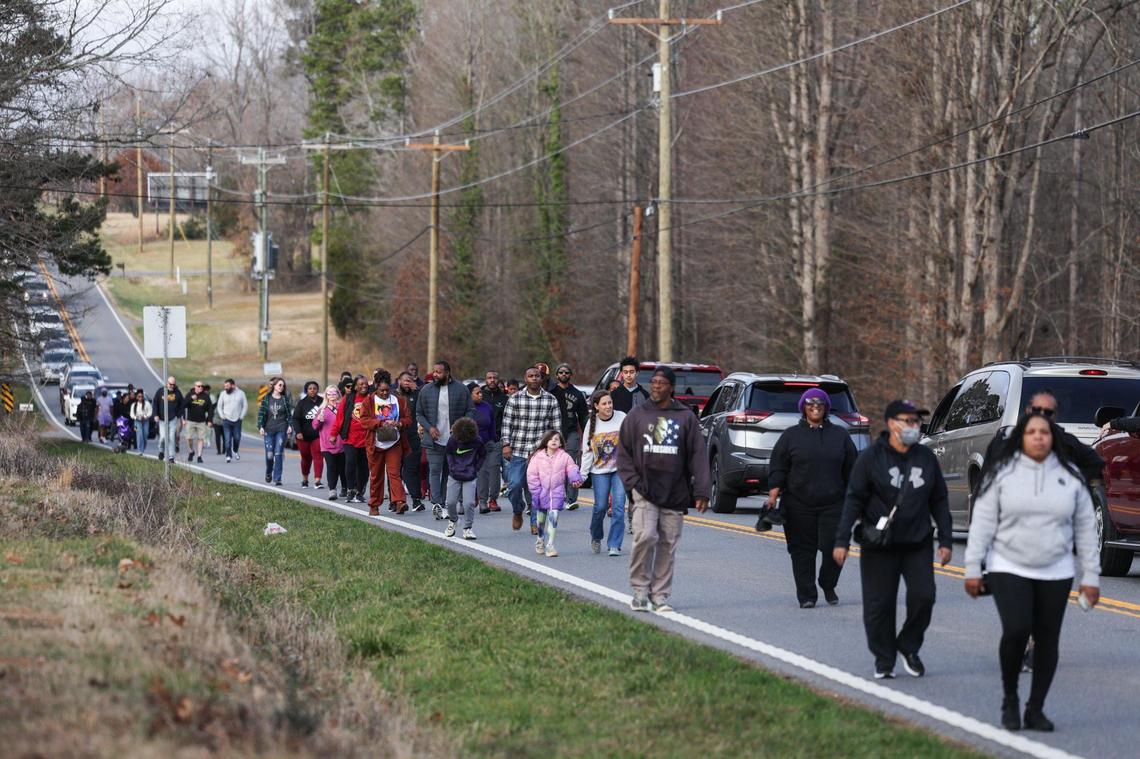 Friends, family and supporters march on Saturday, Feb. 8, on Fallston Road to commemorate the 25th year of Asha Degree going missing in Shelby.