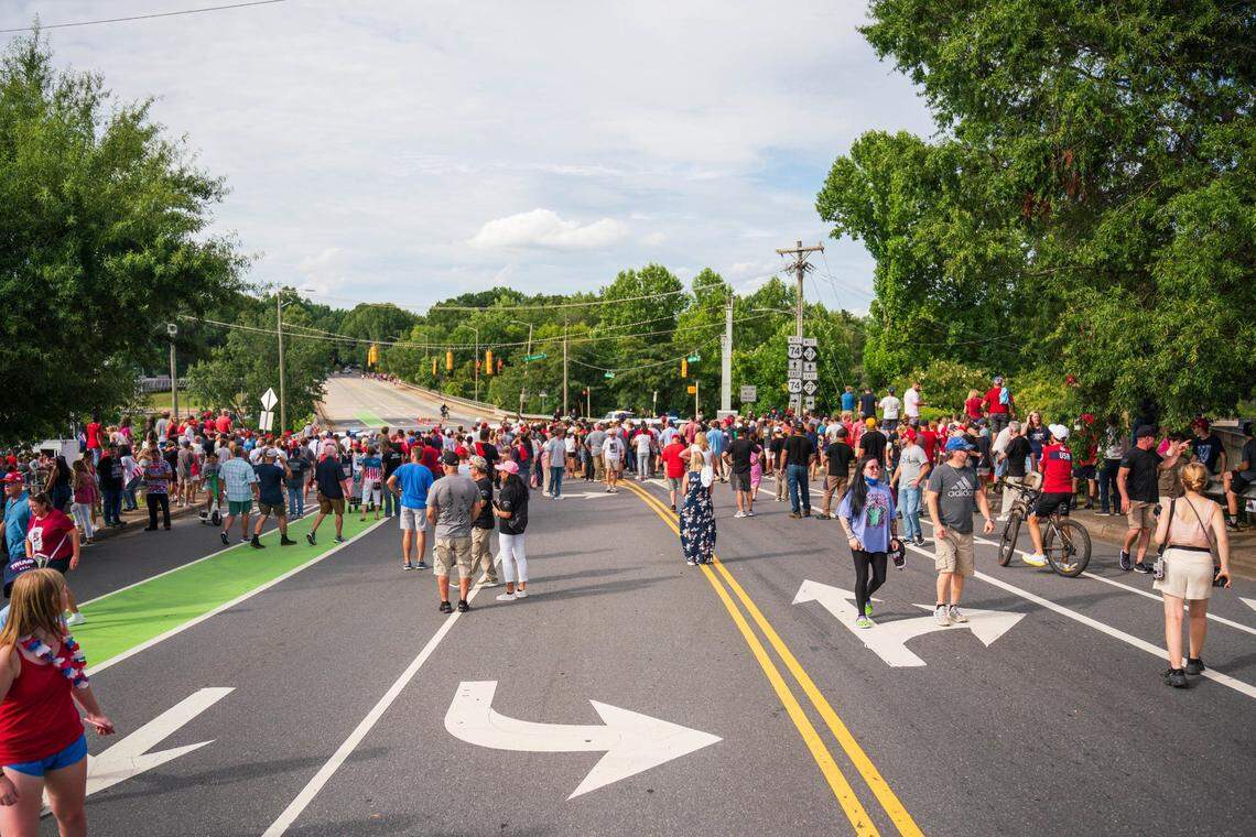 Supporters of former President Donald Trump try to get a glimpse of Trump as he arrives at Bojangles Coliseum in Charlotte on July 24, 2024.