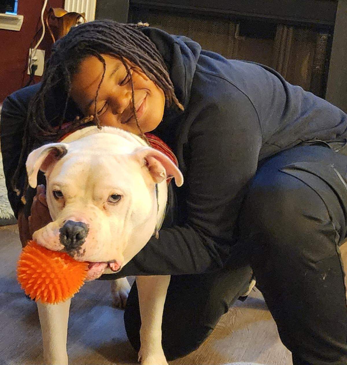Mikey hugs his dog, Ghost, one of the many animals he loved.