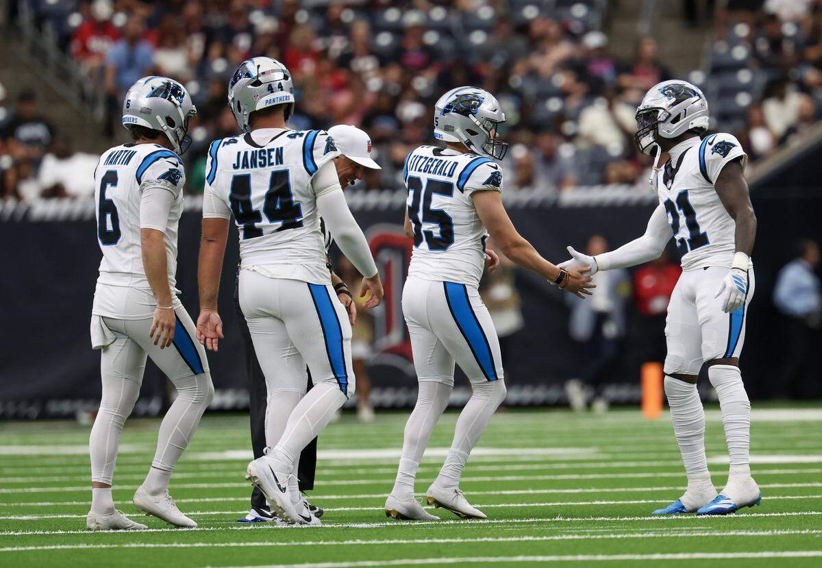 Aug 16, 2025; Houston, Texas, USA; Carolina Panthers safety Nick Scott (21) celebrates Carolina Panthers place kicker Ryan Fitzgerald (35) fifty two yard field goal in the second quarter at NRG Stadium. 