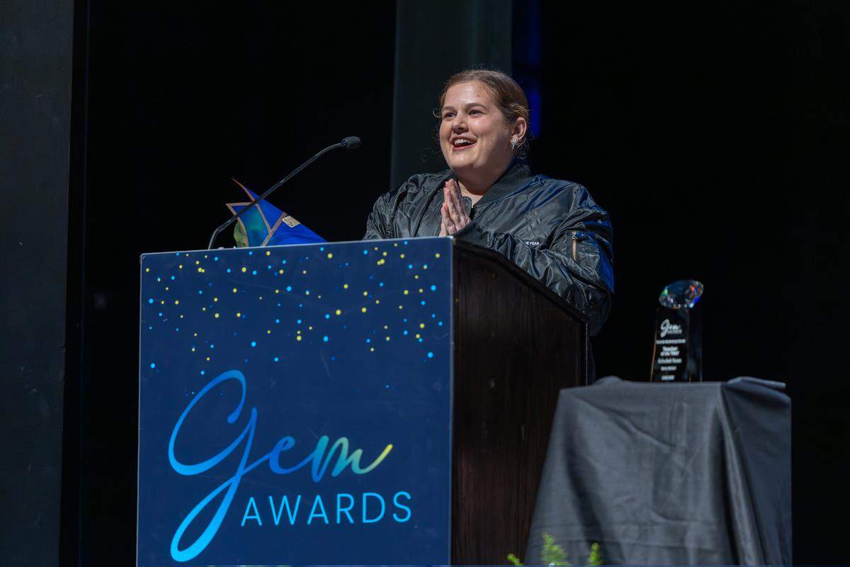 Rebeckah Hauss accepts the award for CMS Teacher of the Year at Central Piedmont Community College on May 5, 2026.
