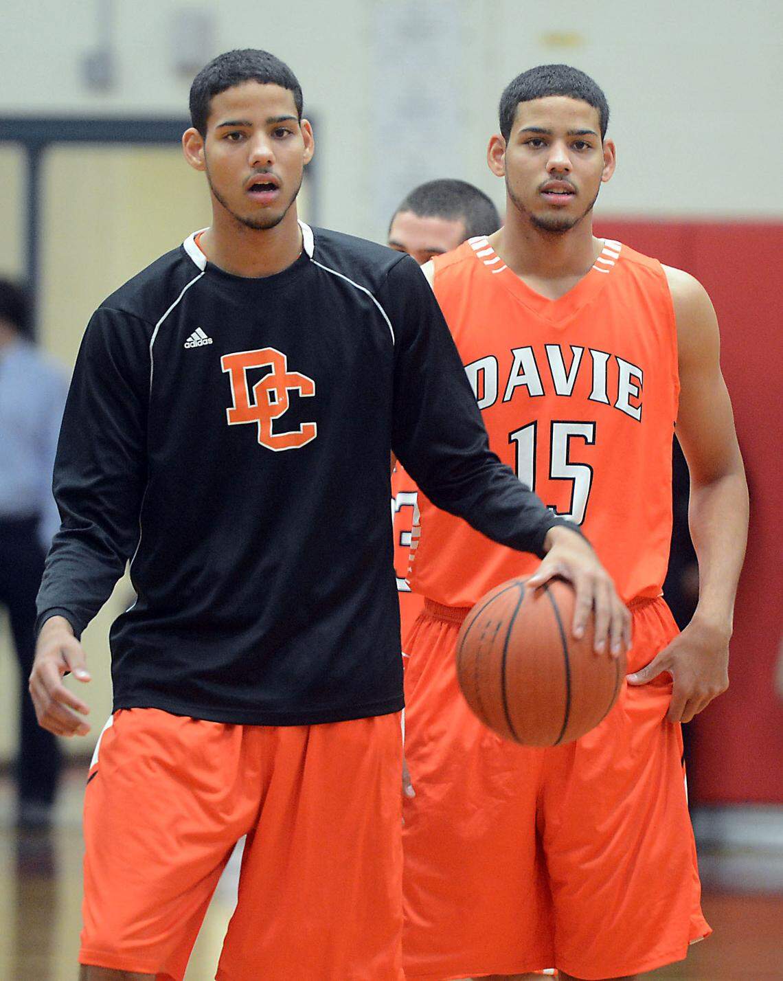 Twins Caleb, left, and Cody Martin of Davie County warm up prior to a game at Olympic High School in 2012. The Martins later played at N.C. State and Nevada before becoming Charlotte Hornets.