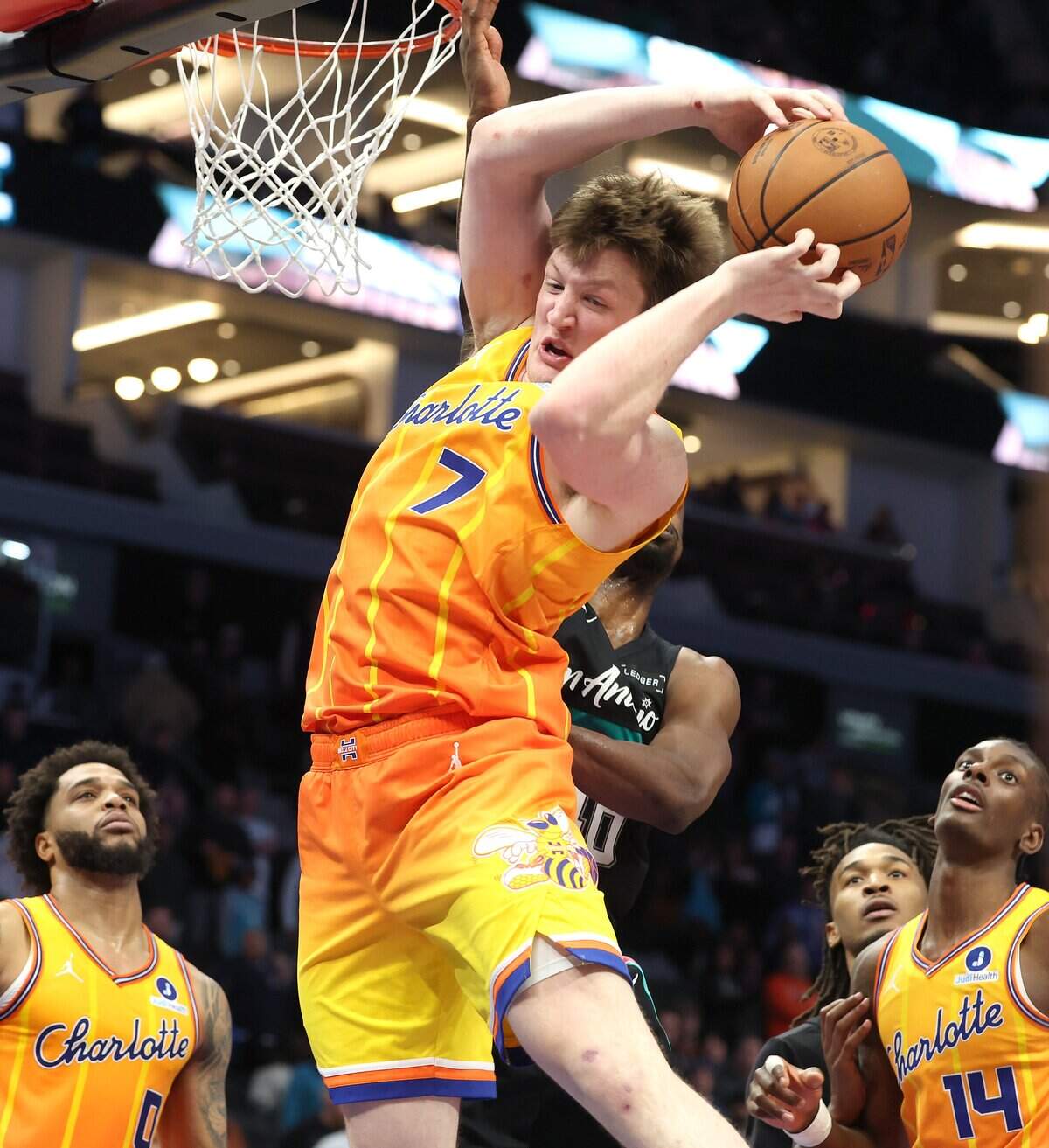 Charlotte Hornets forward Kon Knueppel pulls down a key rebound in the closing moments of action against the San Antonio Spurs at Spectrum Center in Charlotte, NC on Saturday, January 31, 2026. The Hornets defeated the Spurs 111-106.