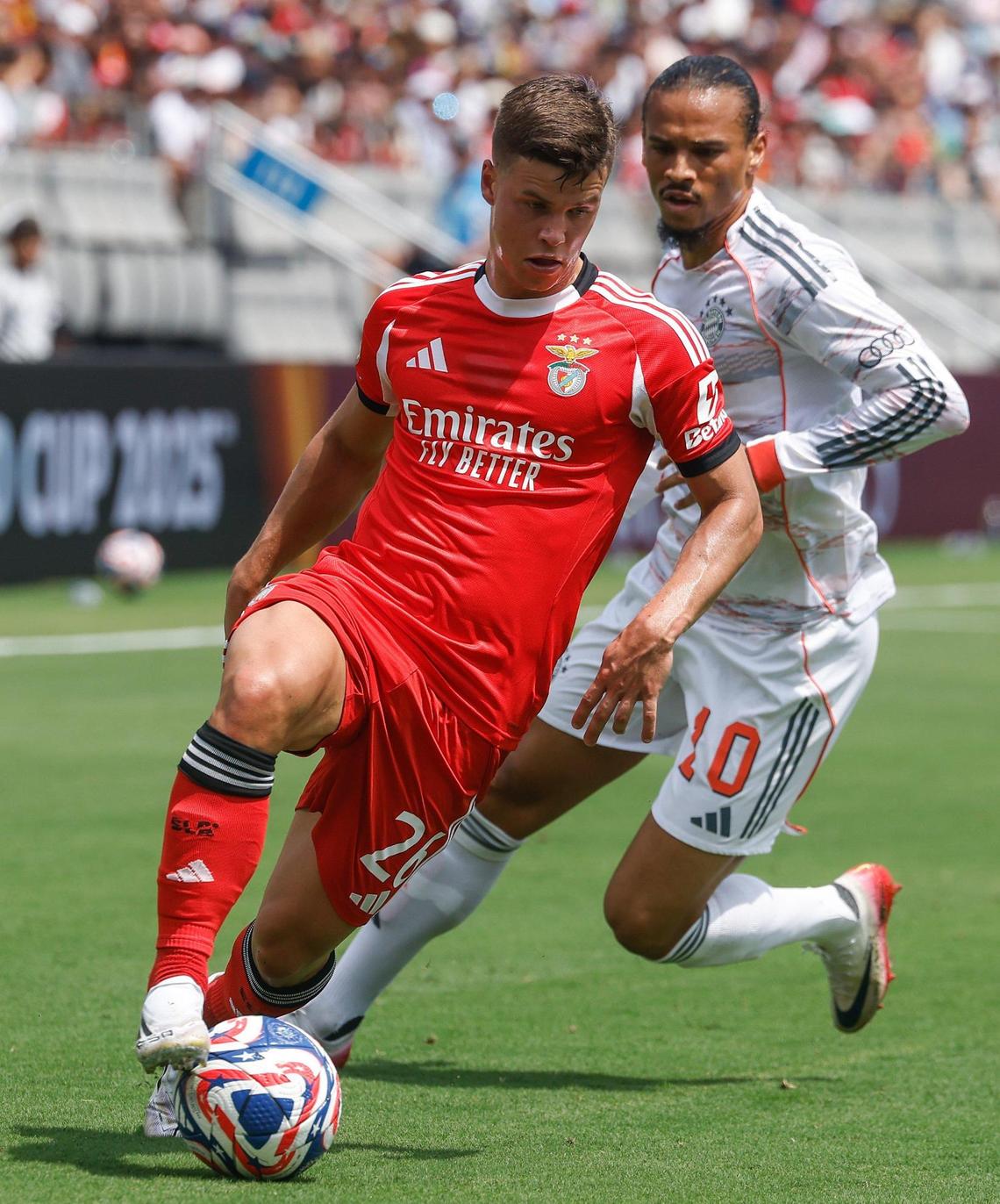 S.L. Benfica’s defender Samuel Dahl, left, dribbles the ball away from Bayern München’s forward Leroy Sane during the FIFA Club World Cup at Bank of America Stadium in Charlotte, NC on Tuesday, June 24, 2025.