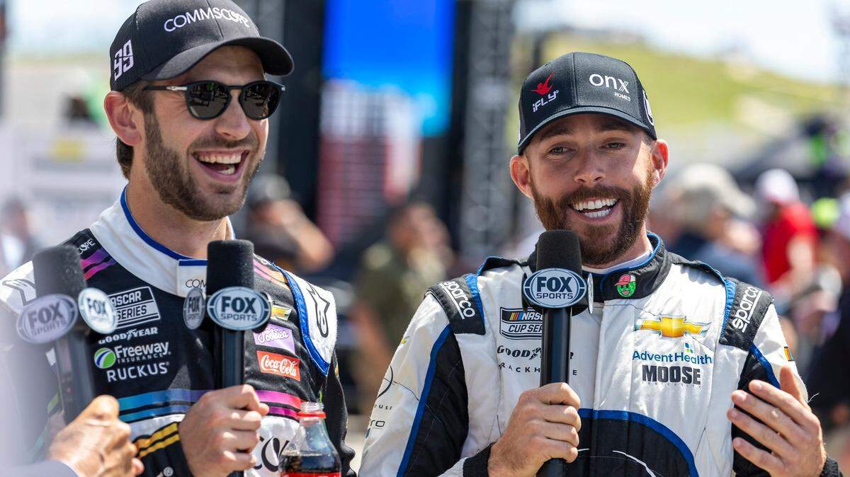 Daniel Suarez, left, and Ross Chastain give a pre-race interview during the NASCAR Cup Series auto race at Circuit of the Americas, Sunday, March 27, 2022, in Austin, Texas. (AP Photo/Stephen Spillman)